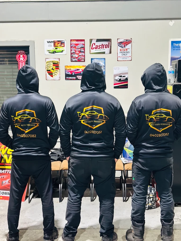 A&T Auto Services team in branded hoodies